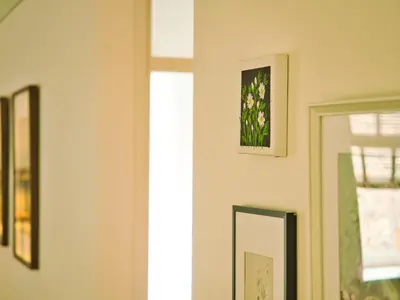 a mirror in a room with flowers on the wall at Stylish & Comfortable 1-Bedroom Apartment in Vilnius Old Town by URBAN RENT in Vilnius