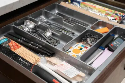 a drawer filled with utensils and other utensils at Hygge Oasis for family with free parking and wi fi in Vilnius
