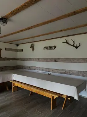 a ping pong table in the corner of a room at Dzūkų sodžius in Snaigupė