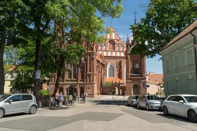 a group of cars parked in front of a church at Old Town Hideaway in Vilnius