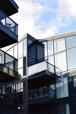 an external view of a glass building at Parko Aveniu Apartamentai B2 in Birštonas