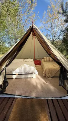 a canvas tent with a bed in it at Glamping under the pines in Vilnius