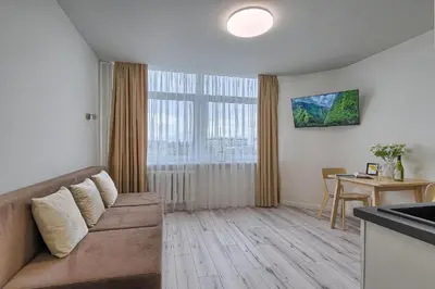 a living room with a couch and a table at Old Town Edvin Apartments in Vilnius
