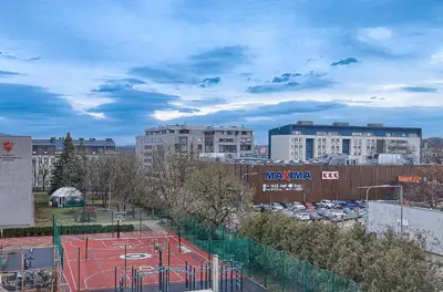 a tennis court in the middle of a city at Old Town Edvin Apartments in Vilnius
