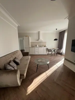 a living room with a couch and a table at Sigita in Šveicarija