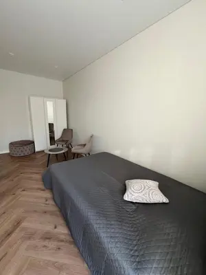 a bedroom with a bed with a pillow on it at Sigita in Šveicarija