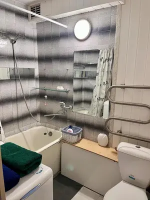 a bathroom with a toilet and a sink and a mirror at Apartment in the city Kaunas in Kaunas