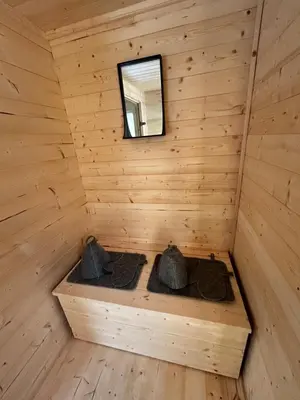 a inside of a wooden cabin with a window at Spalvotas Beržas in Lyduokiai