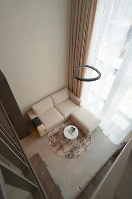 a living room with a couch and a table at K32 Loft in Vilnius