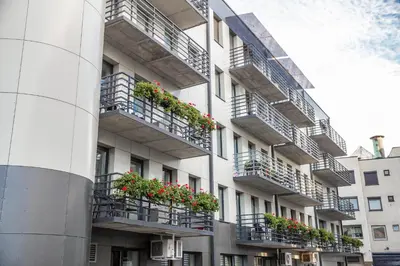 an apartment building with flower boxes on balconies at HOF Apartments in Kaunas