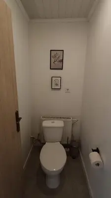 a bathroom with a white toilet in a room at 2 Bedrooms Apartment Vilnius Center in Vilnius