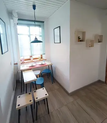 a room with a table and chairs and a window at 2 Bedrooms Apartment Vilnius Center in Vilnius