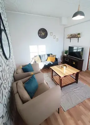 a living room with a couch and a table at 2 Bedrooms Apartment Vilnius Center in Vilnius
