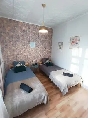 a room with two beds in a room at 2 Bedrooms Apartment Vilnius Center in Vilnius