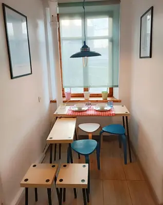 a dining room with a table and chairs and a window at 2 Bedrooms Apartment Vilnius Center in Vilnius