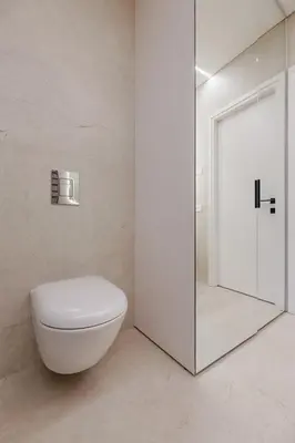 a white bathroom with a toilet and a shower at Nemunaičiai Relax in Kaunas