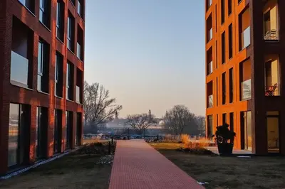 a walkway between two tall buildings in a city at Nemunaičiai Relax in Kaunas