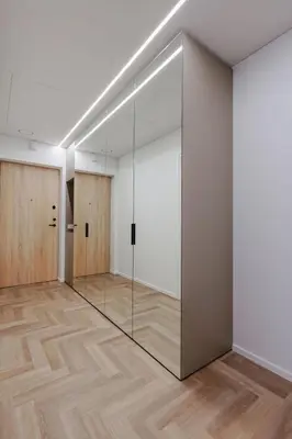 an empty room with glass doors and wood floors at Nemunaičiai Relax in Kaunas