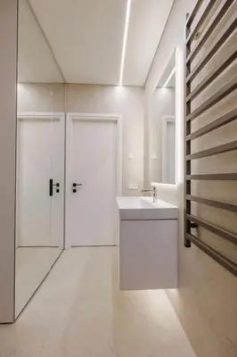 a white bathroom with a sink and a shower at Nemunaičiai Relax in Kaunas