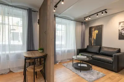 a living room with a couch and a table at Apartments in the old town in Vilnius