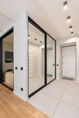 a room with sliding glass doors in a bedroom at Apartments in the old town in Vilnius