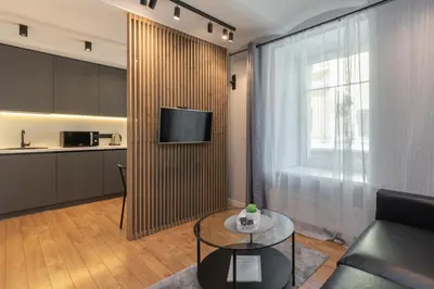 a living room with a couch and a table at Apartments in the old town in Vilnius