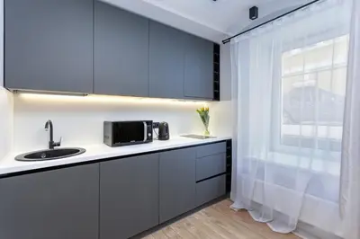 a kitchen with a sink and a window at Apartments in the old town in Vilnius