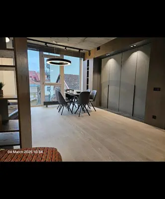 a dining room with chairs and a table with a view at Happy Inn VIP Lounge, self check-in, parking in Vilnius