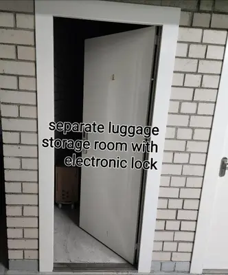 a doorway to a storage room with an electronic lock at Happy Inn VIP Lounge, self check-in, parking in Vilnius