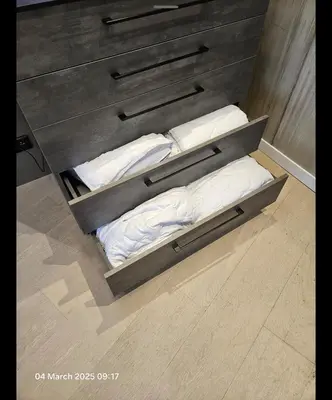 a bed with three pillows in a room at Happy Inn VIP Lounge, self check-in, parking in Vilnius