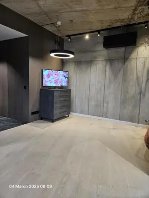 a large room with a flat screen tv in it at Happy Inn VIP Lounge, self check-in, parking in Vilnius