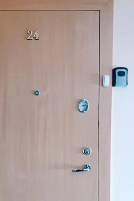 a wooden door with the number on it at SUN CITY Varpo Apartment in Šiauliai