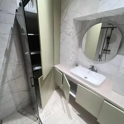 a bathroom with a sink and a mirror at City central apartment in Vilnius