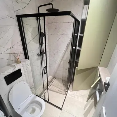 a bathroom with a shower and a toilet at City central apartment in Vilnius