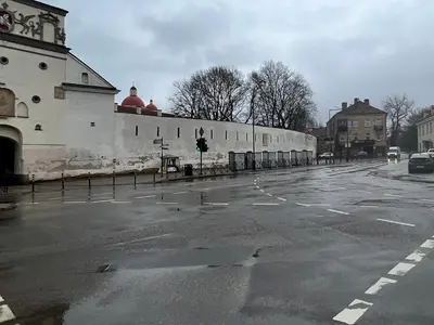 an empty parking lot in front of a building at City central apartment in Vilnius