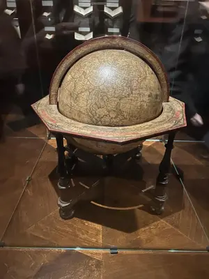 an old chair on display in a museum at City central apartment in Vilnius