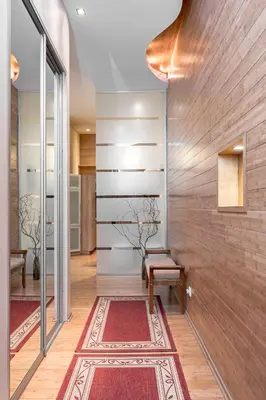 a hallway with red rugs and a wooden wall at Cozy 2-Bedroom Apartment - 4 in Vilnius