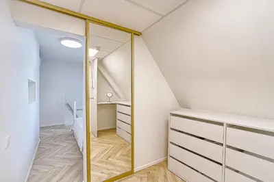 a room with a closet and a staircase at Amazing apartments 2 x free parking x 24x7 in Vilnius
