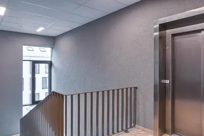 an elevator in an office building with a hallway at Amazing apartments 2 x free parking x 24x7 in Vilnius