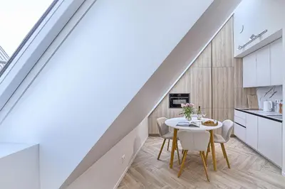 a kitchen and dining room with a table and chairs at Amazing apartments 2 x free parking x 24x7 in Vilnius
