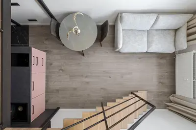 a room with a staircase and a wall at Pinky loft in City centre Self check-in No 3 in Vilnius