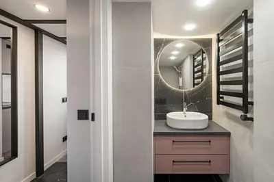 a bathroom with a sink and a mirror at Pinky loft in City centre Self check-in No 3 in Vilnius