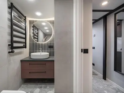 a bathroom with a sink and a mirror at Rusty Red loft in City centre Self check-in No 2 in Vilnius