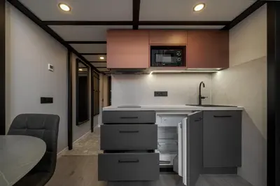 a kitchen with a sink and a counter top at Rusty Red loft in City centre Self check-in No 2 in Vilnius