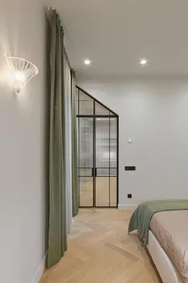 a bedroom with a bed and some curtains at Luxury Courtyard Old-Town Residence in Vilnius
