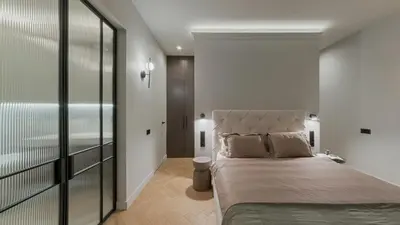 a bedroom with a large bed in a room at Luxury Courtyard Old-Town Residence in Vilnius