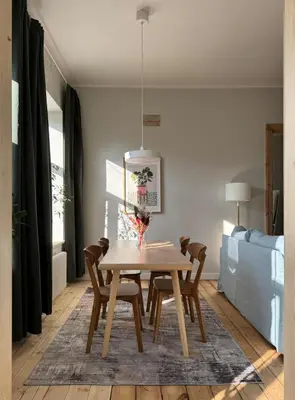 a dining room with a table and chairs at Stepono Apartment in Vilnius