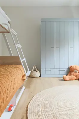 a bedroom with a bunk bed and a ladder at Vila 44 in Druskininkai
