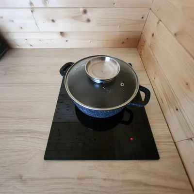 a pot on top of a stove in a room at Vipoilsis Namelis N3 in Čekoniškės