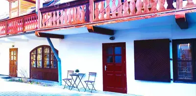 a building with two chairs and a table and two doors at Prime Location Apartment Vilnius in Vilnius